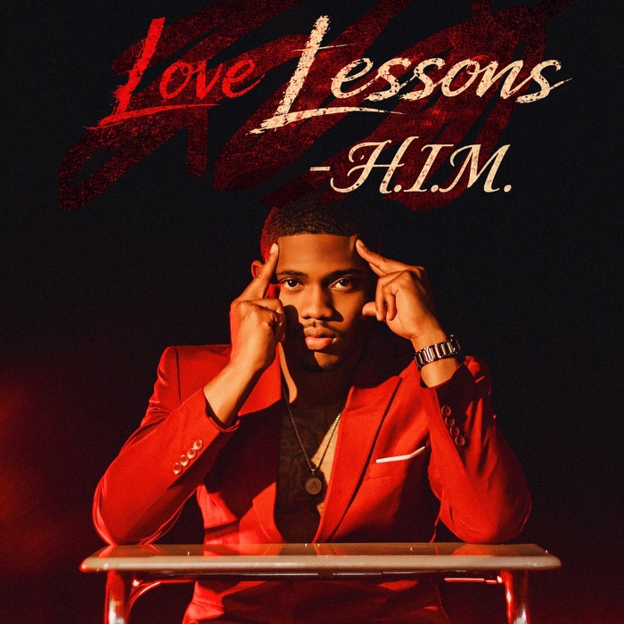 Young man in red suit sitting at a desk with hands on temples, dark background, text reads 'Love Lessons - H.I.M.'