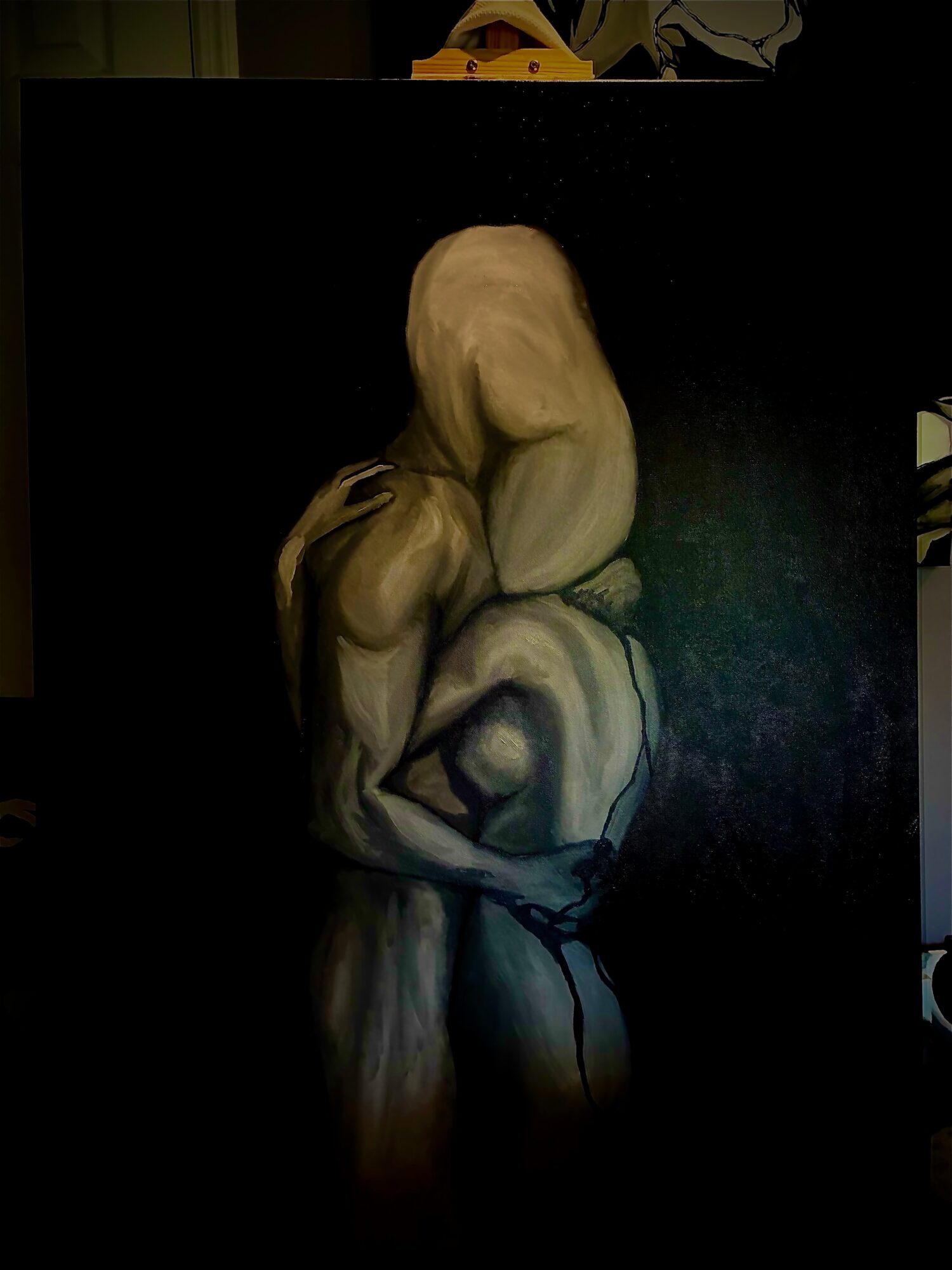 Three intertwined, abstract human figures with elongated limbs and heads, depicted in a dark background with light highlighting their forms.