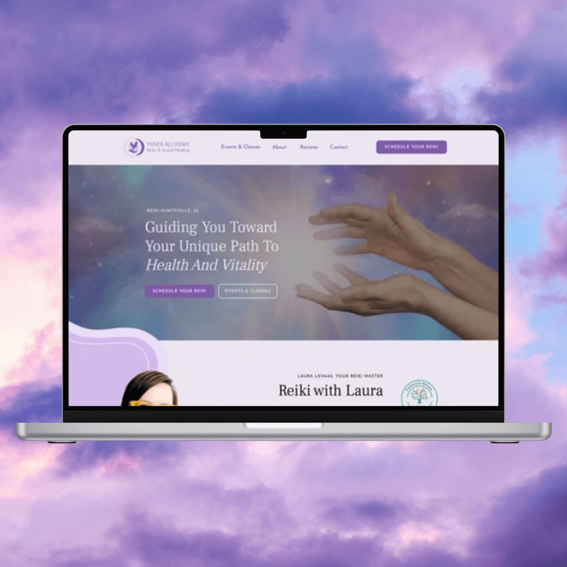 Laptop displaying a website with a purple and blue sky background, hands reaching out, and text about health and vitality.