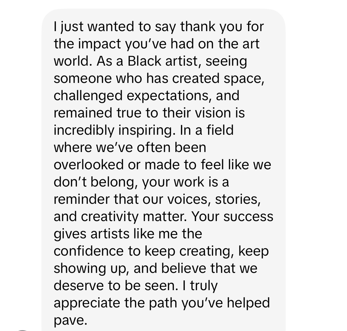 A text message expressing gratitude and admiration for an artist's inspiring work and impact.
