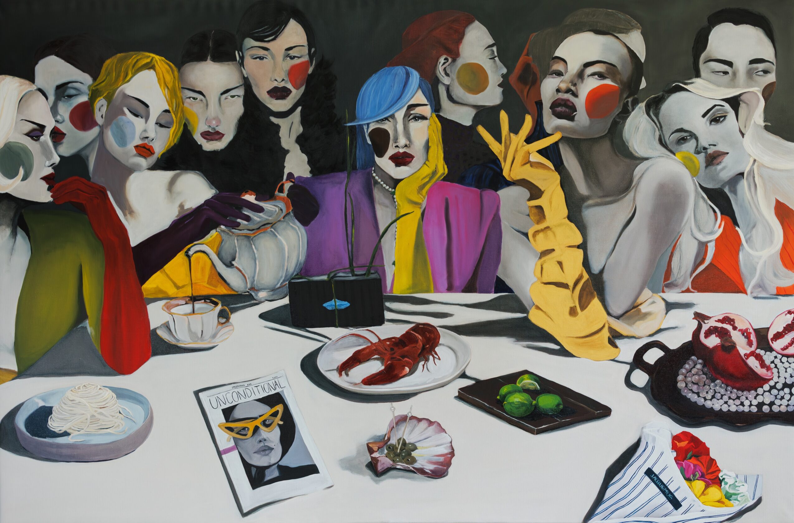 Group of women with painted faces sitting at a table with food and drinks, colorful clothing, and expressive poses.