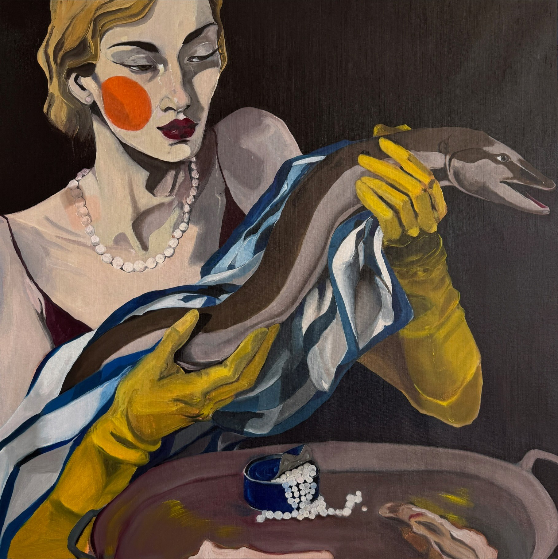 Woman with red cheeks and yellow gloves holds a snake wrapped in cloth, with jewelry and a dark background.