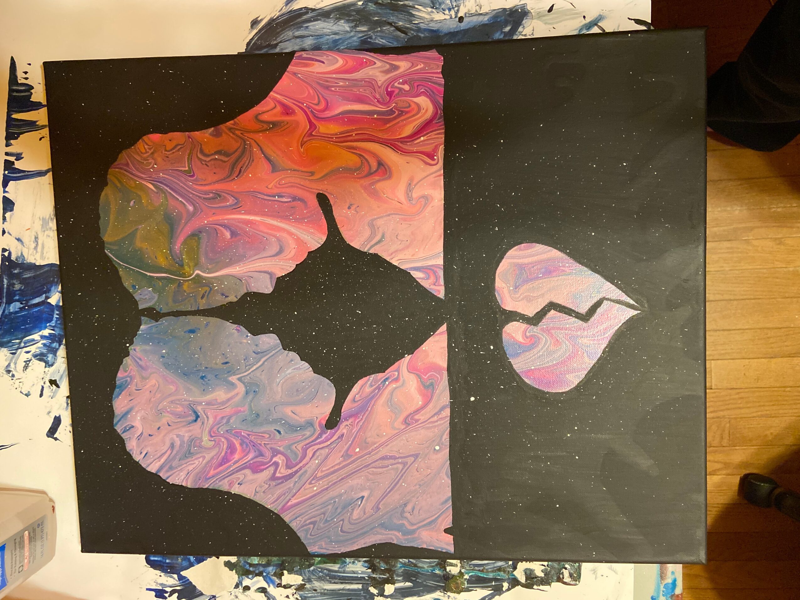 Abstract painting with a black background, featuring colorful, swirling shapes resembling a butterfly and lips, with star-like dots.